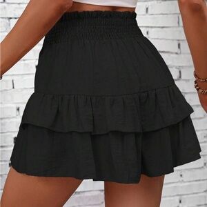 Brand new never worn. Black shorts that look like a skirt.